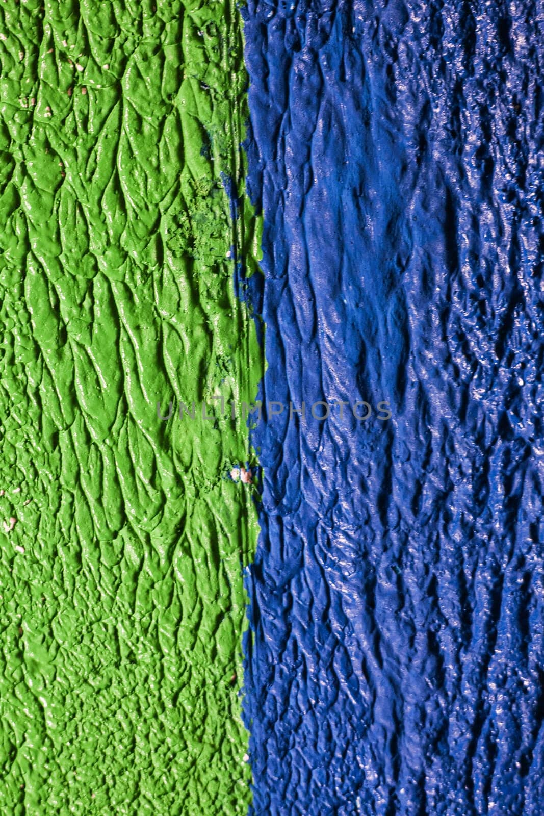 Two-color blue-green background. Rough plaster of two colors.