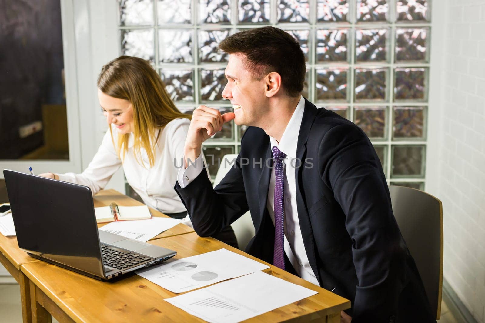 business couple working together on project at modern startup office