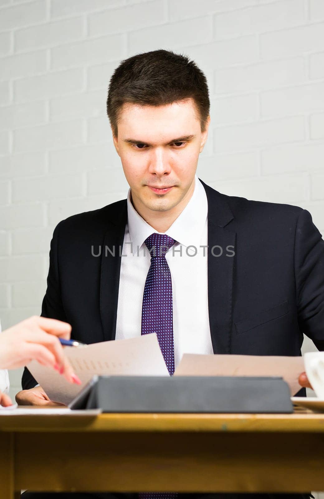 Business man working at office with documents on his desk, consultant lawyer concept.