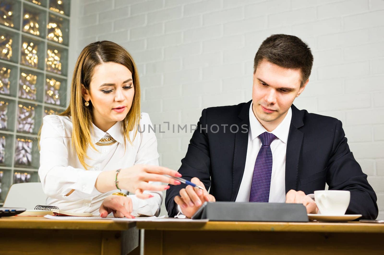 business couple working together on project at modern startup office
