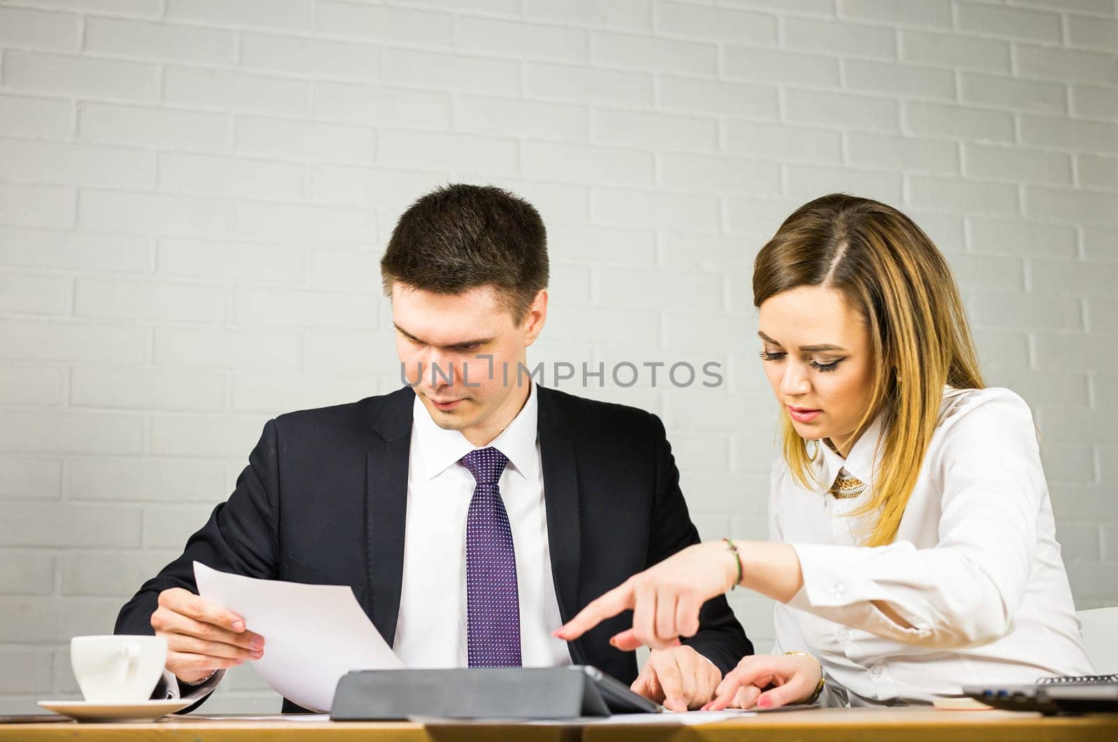business couple working together on project at modern startup office