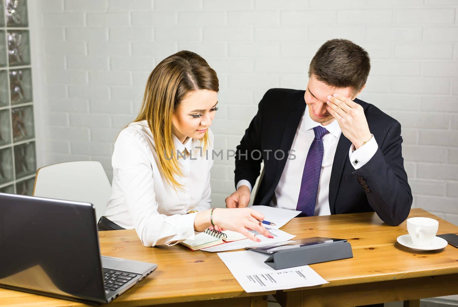 business couple working together on project at modern startup office