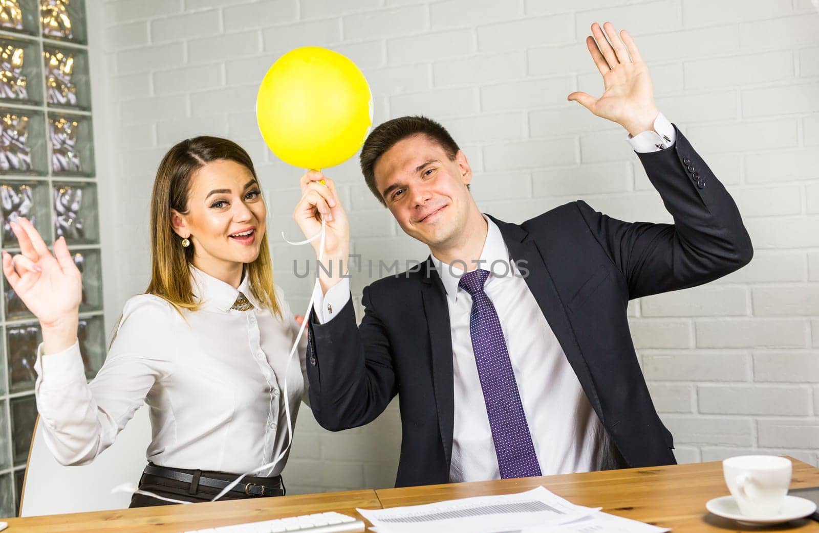 Casual business team celebrating in the office