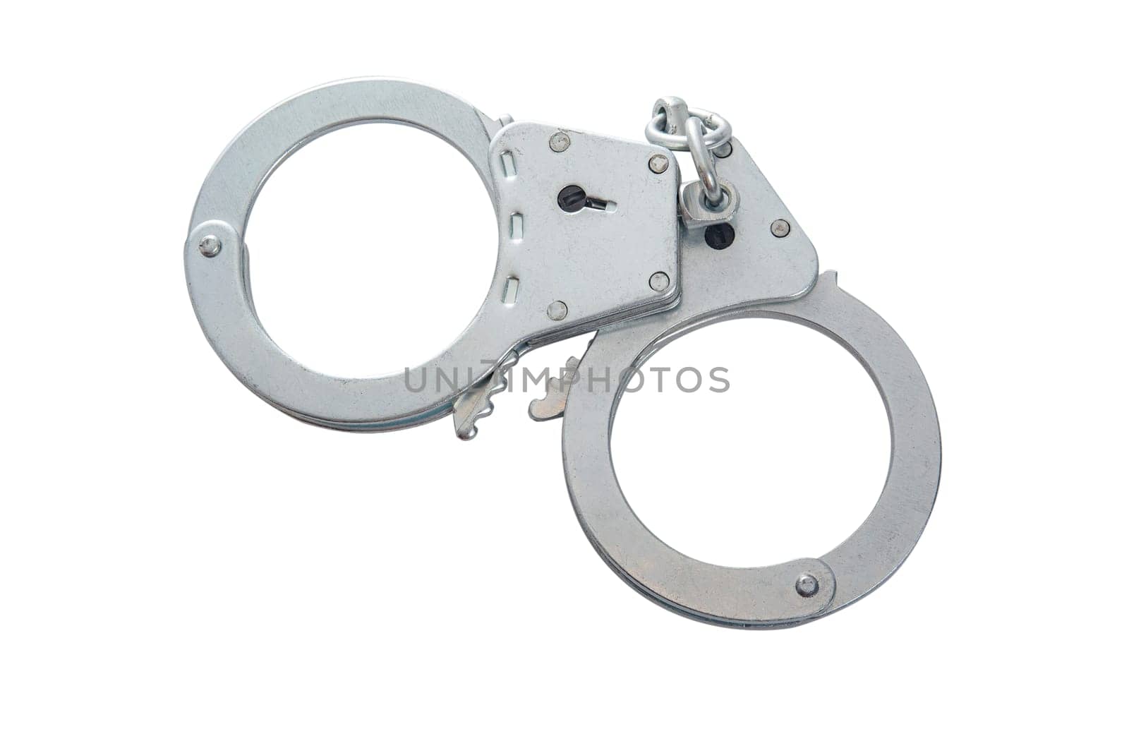 Metal handcuffs on a white isolated background, copy space. High quality photo