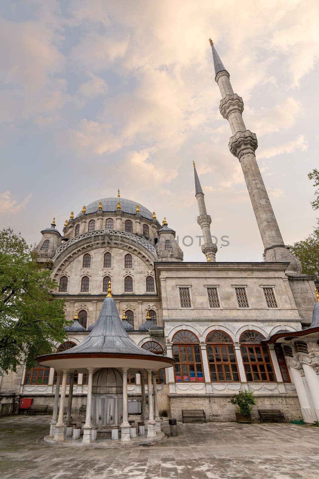 Courtyard of Nusretiye imperial Ottoman Mosque, with ablution fountain in the front, located in Tophane district of Beyoglu, Istanbul, Turkey