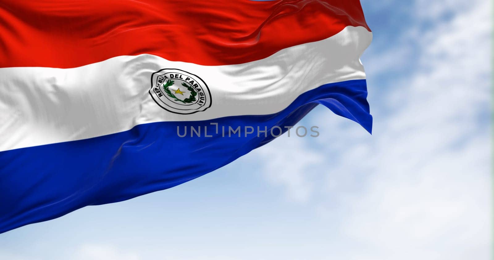 Paraguay flag waving in the wind on a clear day. Red, white and blue horizontal stripes with Coat of arms in the center. 3d illustration render. Fluttering fabric