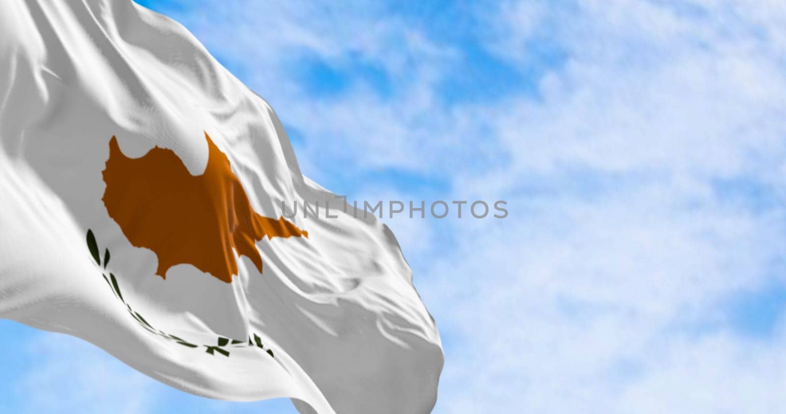 Cyprus national flag waving in the wind on a clear day. White with a copper-orange island silhouette and two green olive branches below it. 3d illustration render. Fluttering textile