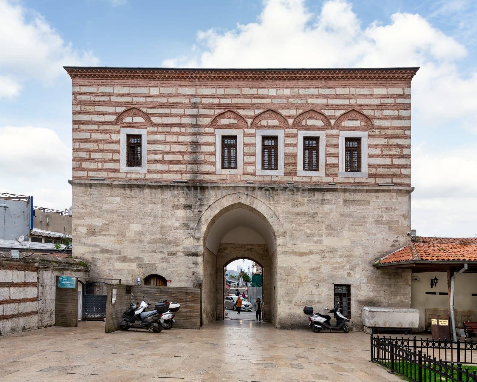 Istanbul, Turkey - May 5, 2023: Main gate of Yeni Valide I Mosque, or Yeni Valide Camii, an 18th century Ottoman mosque located in Uskudar district, on the Asian side of Istanbul