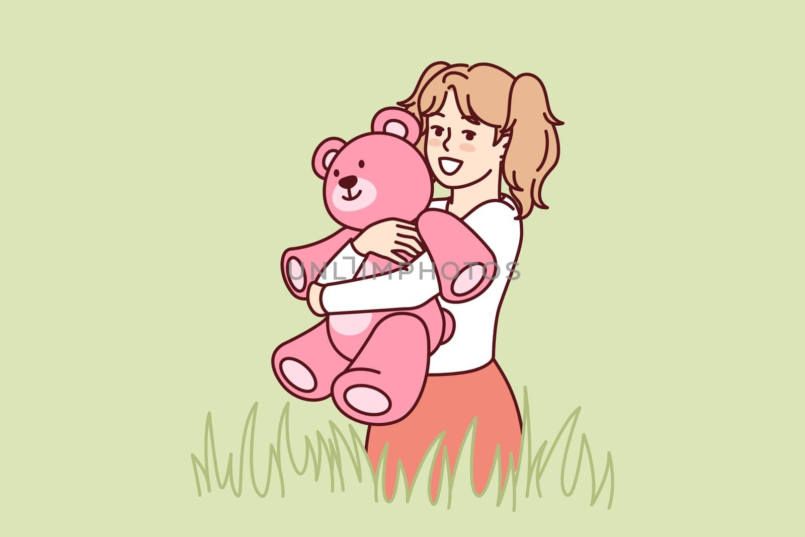 Happy little girl with teddy bear in hands stands in meadow among tall grass and looks at screen. Child with smile hugs beloved toy bear, presented for birthday, during summer walk
