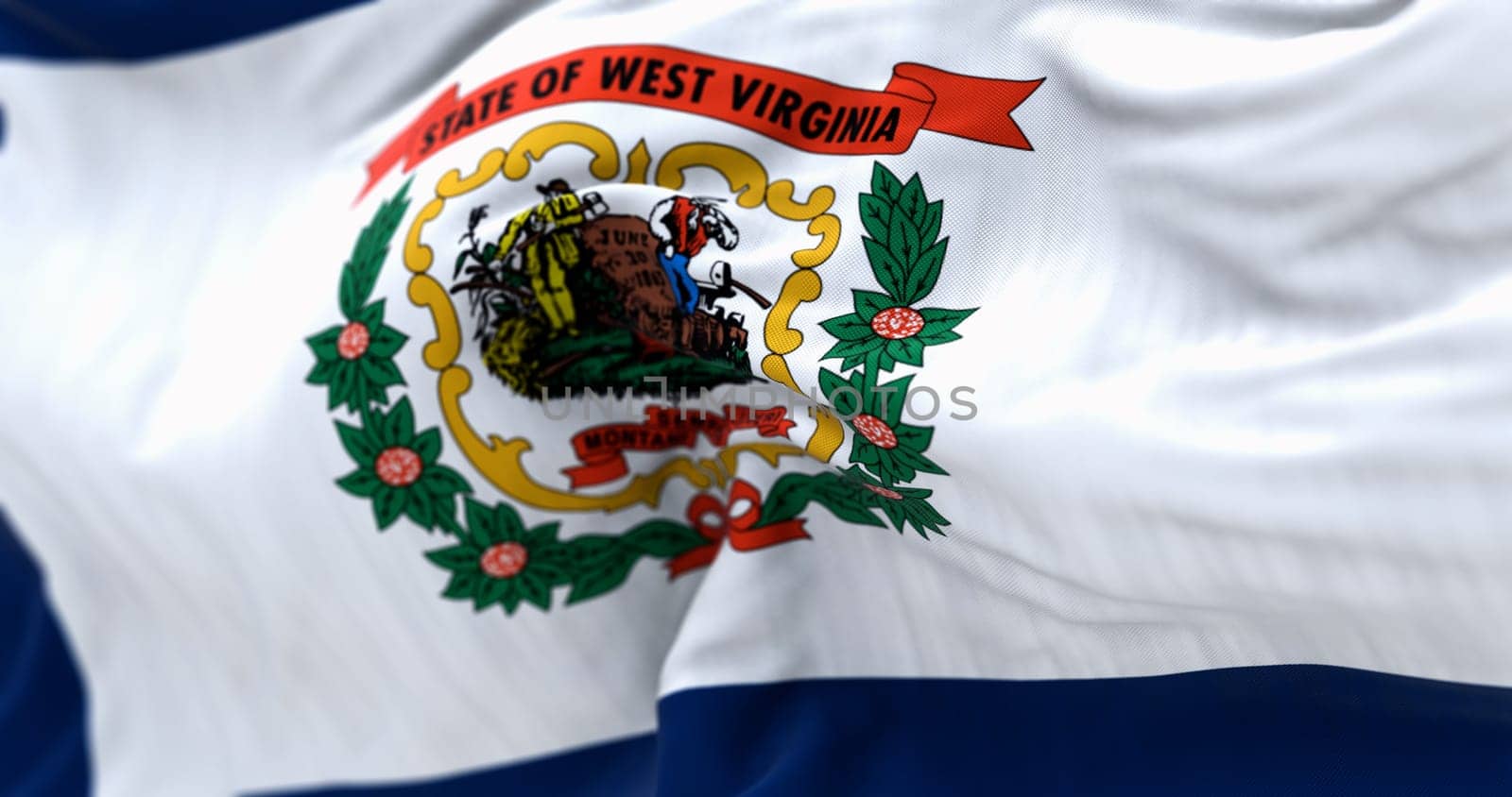 Close-up of West Virginia state flag waving in the wind. White field, blue border, state coat of arms, and red ribbon. 3d illustration render. Fluttering fabric. Selective focus