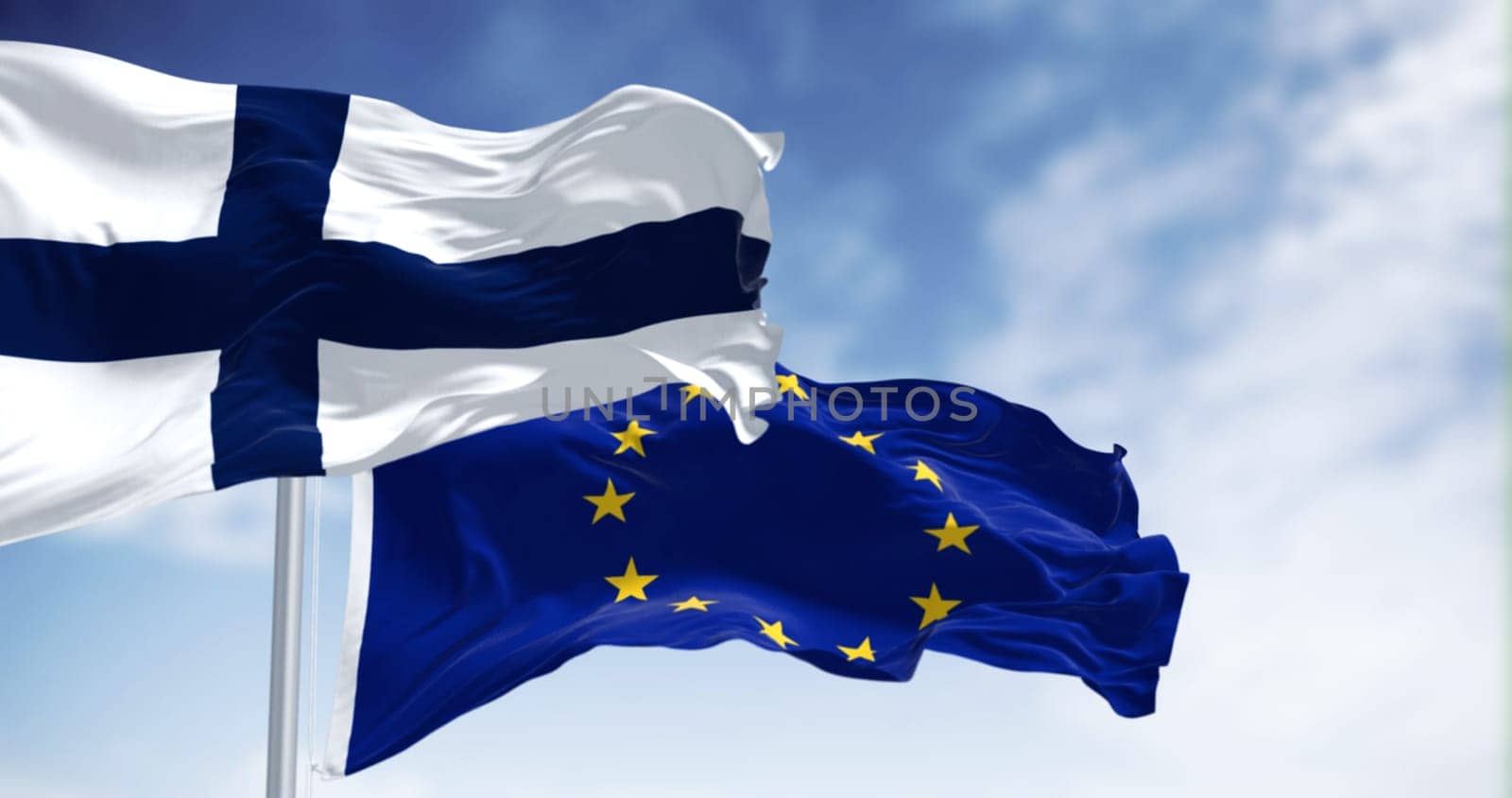 Finland and the European flag waving in the wind on a clear day. Finland joined the European Union in 1995. 3d illustration render. Fluttering fabric
