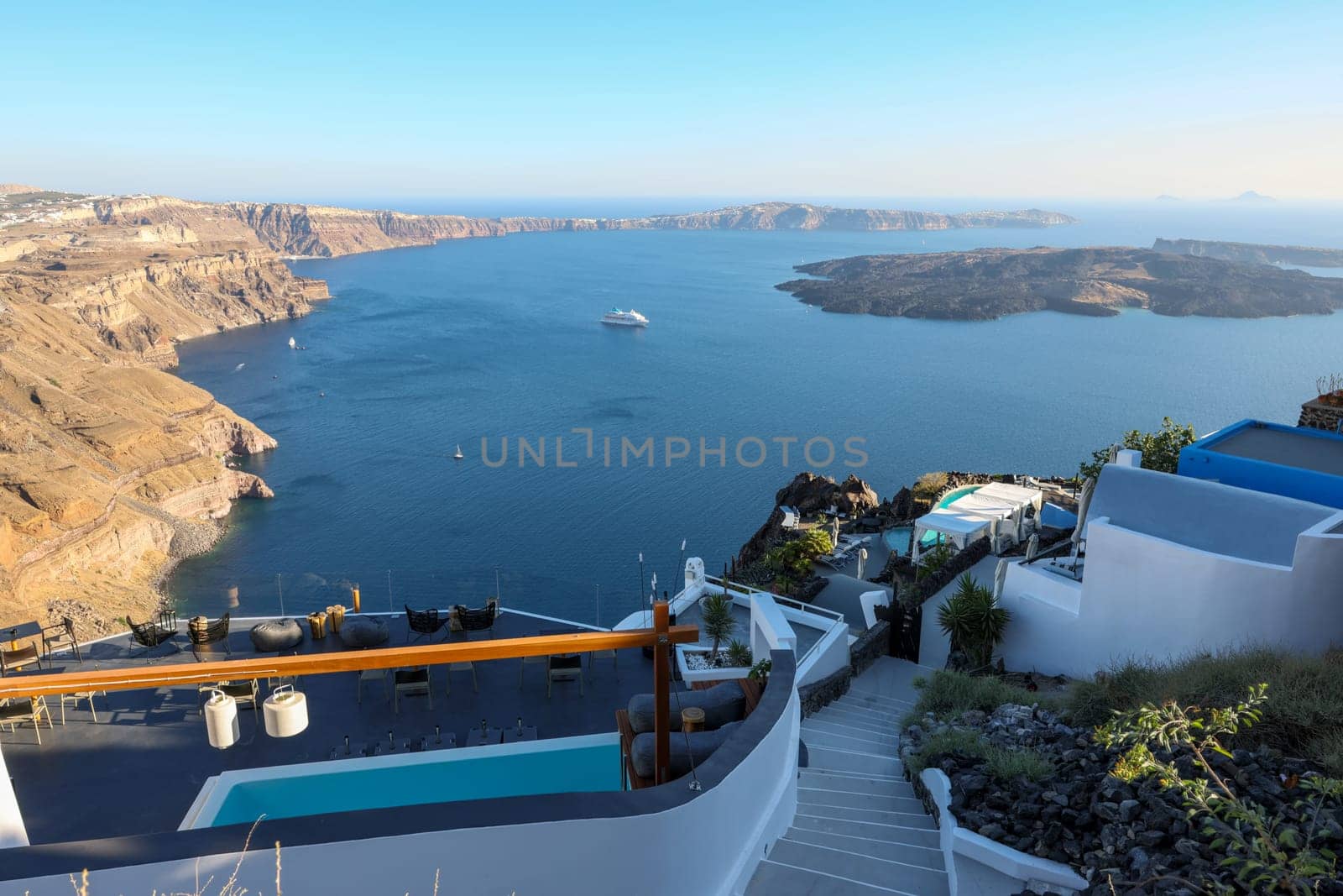 Panoramic view of the Santorini caldera cliffs from the Imerovigli village on Santorini island, Greece
