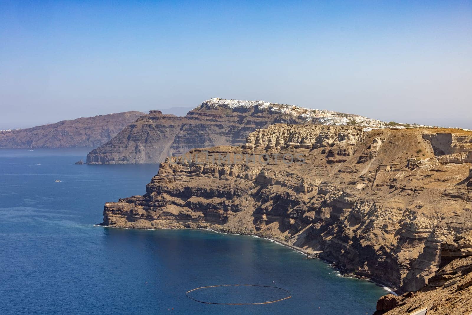 Magnificent view of the majestic volcanic cliffs of Santorini Island, Greece.