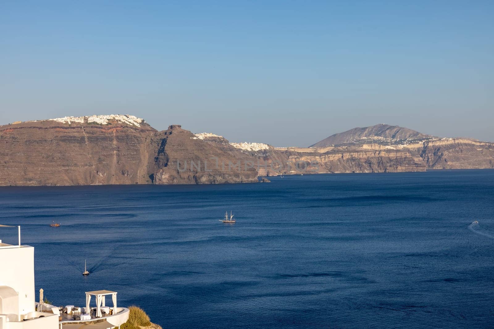 Panoramic view of the Santorini caldera cliffs from Oia village on Santorini island, Greece