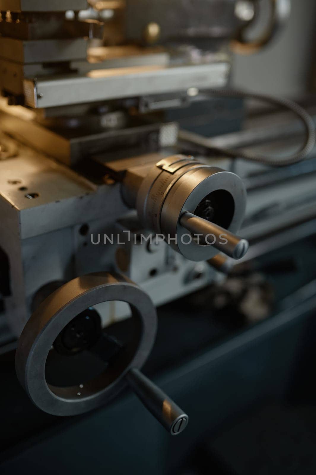Professional lathe turning machine at garage workshop, selective focus