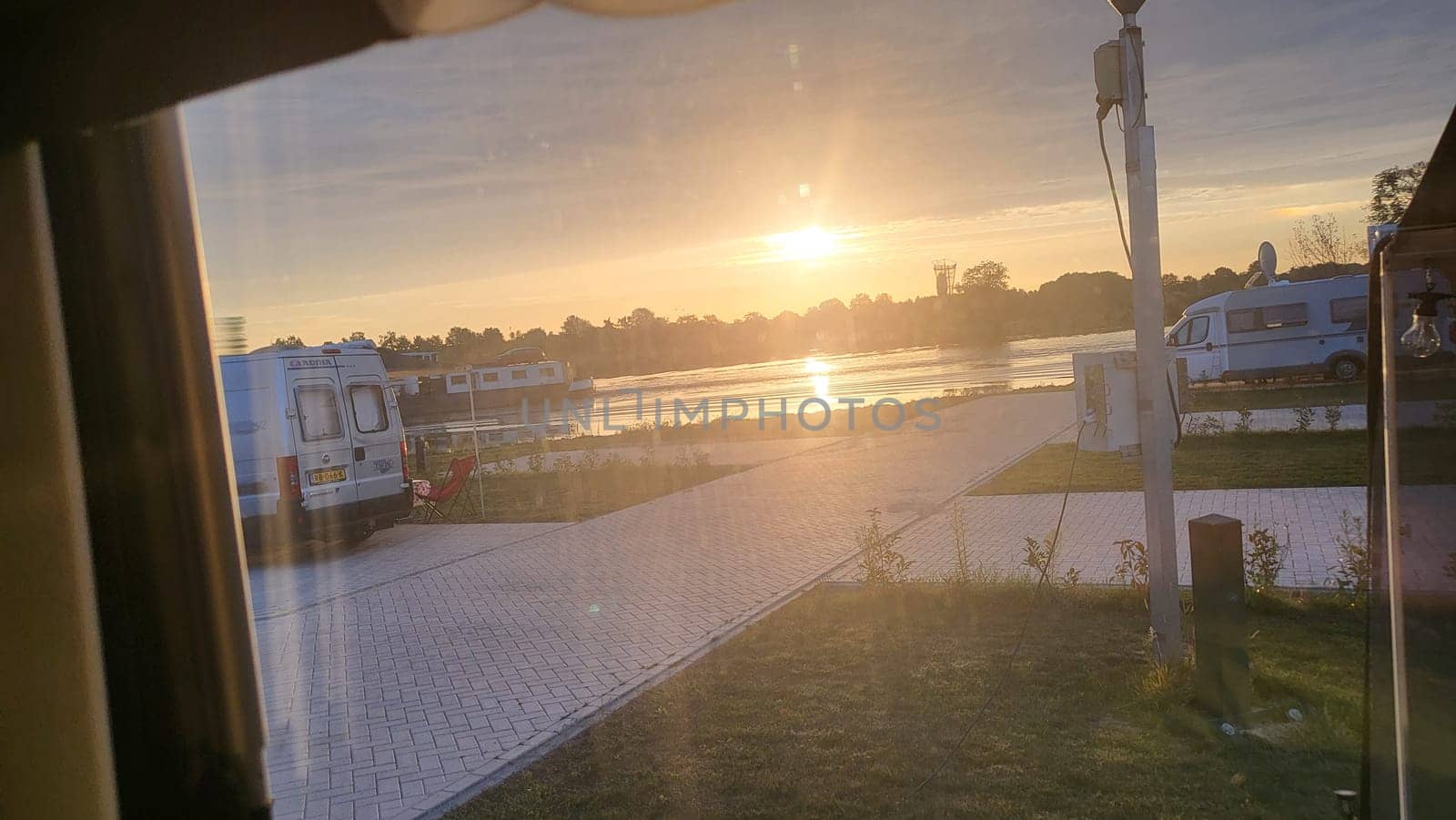 Blitterswijck, The Netherlands - August 22, 2022: Campers parked on a Camer Van pitch. Concept camper van leisure and fun