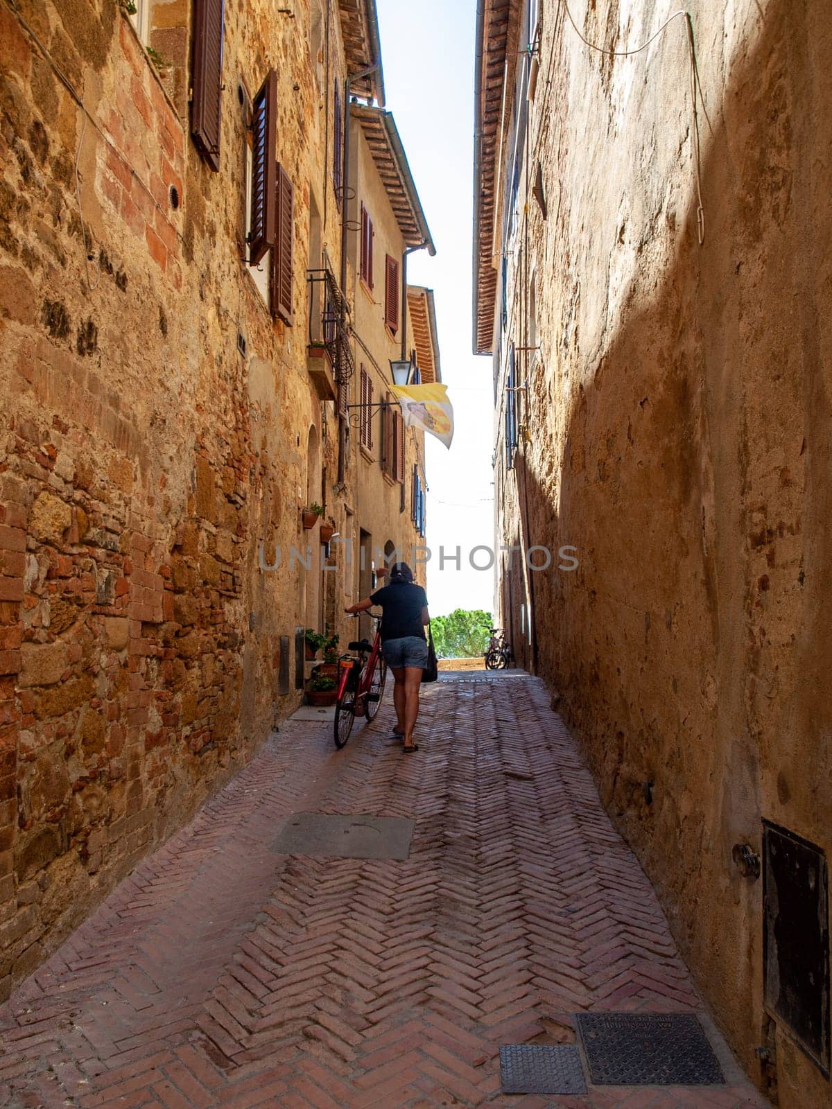 Pienza, Italy - Sept 12, 2022: Pienza, a tiny village in the Tuscany, known as the ideal city of the Renaissance and a capital of pecorino cheese. UNESCO World Heritage Site.