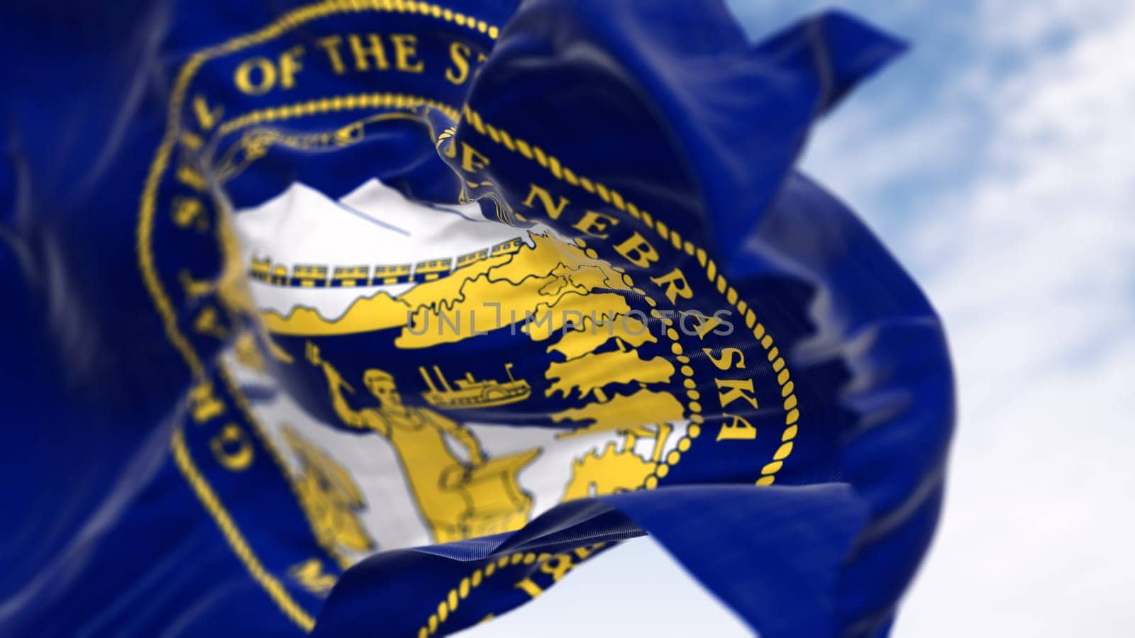 Close-up of the Nebraska state flag fluttering. The flag of is blue with the state seal in the center. 3D illustration render. Close-up. Fluttering fabric. Selective focus