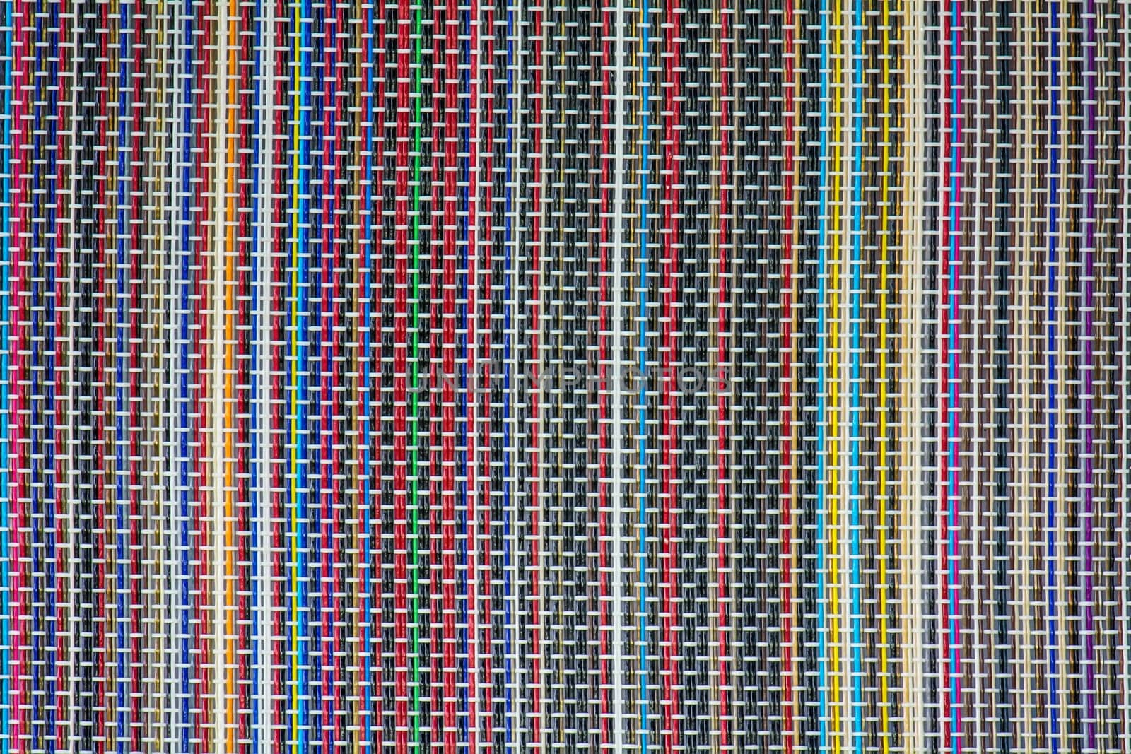 The wicker surface is made with colorful patterns.