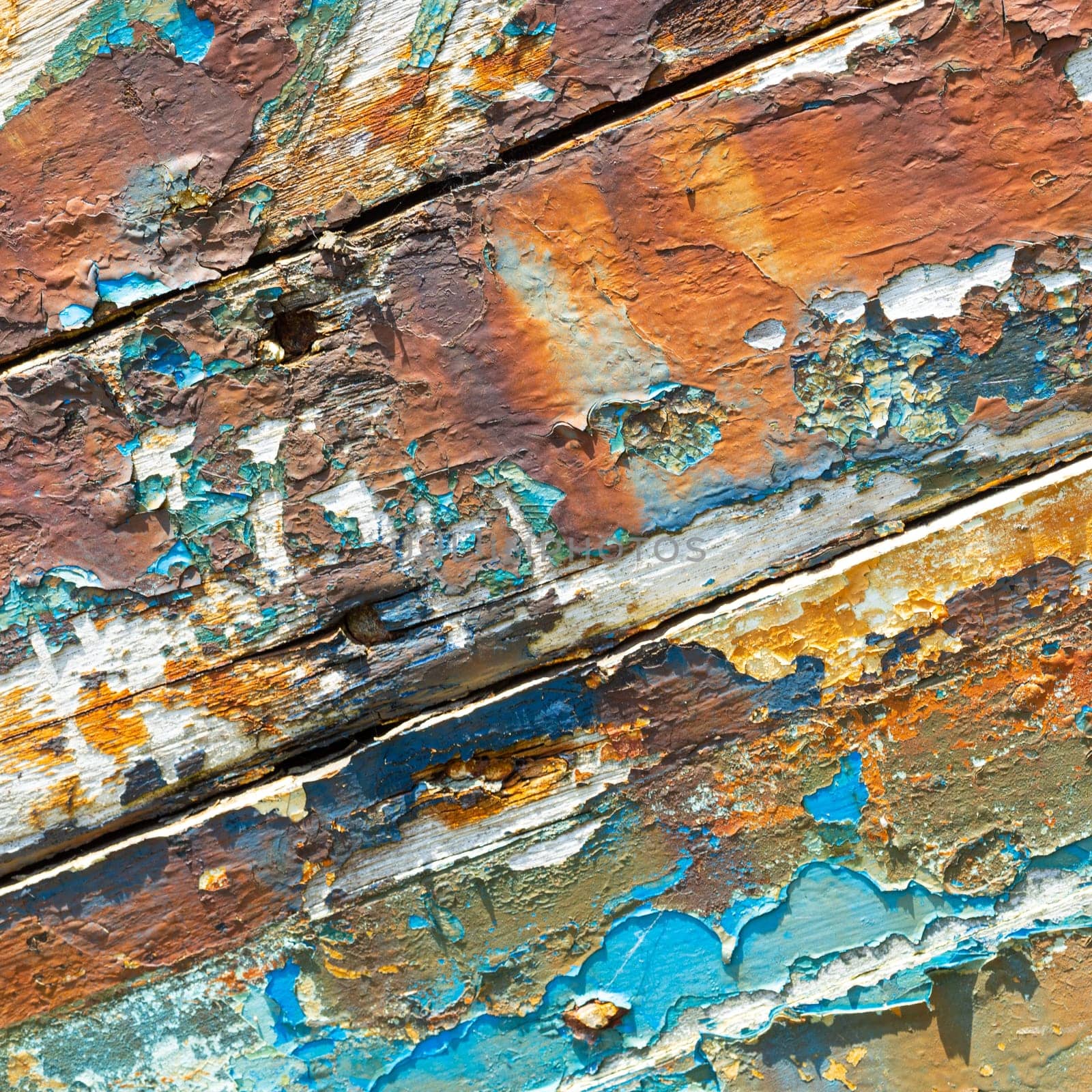 Peeling weathered hull paint, background texture with harsh shaddows