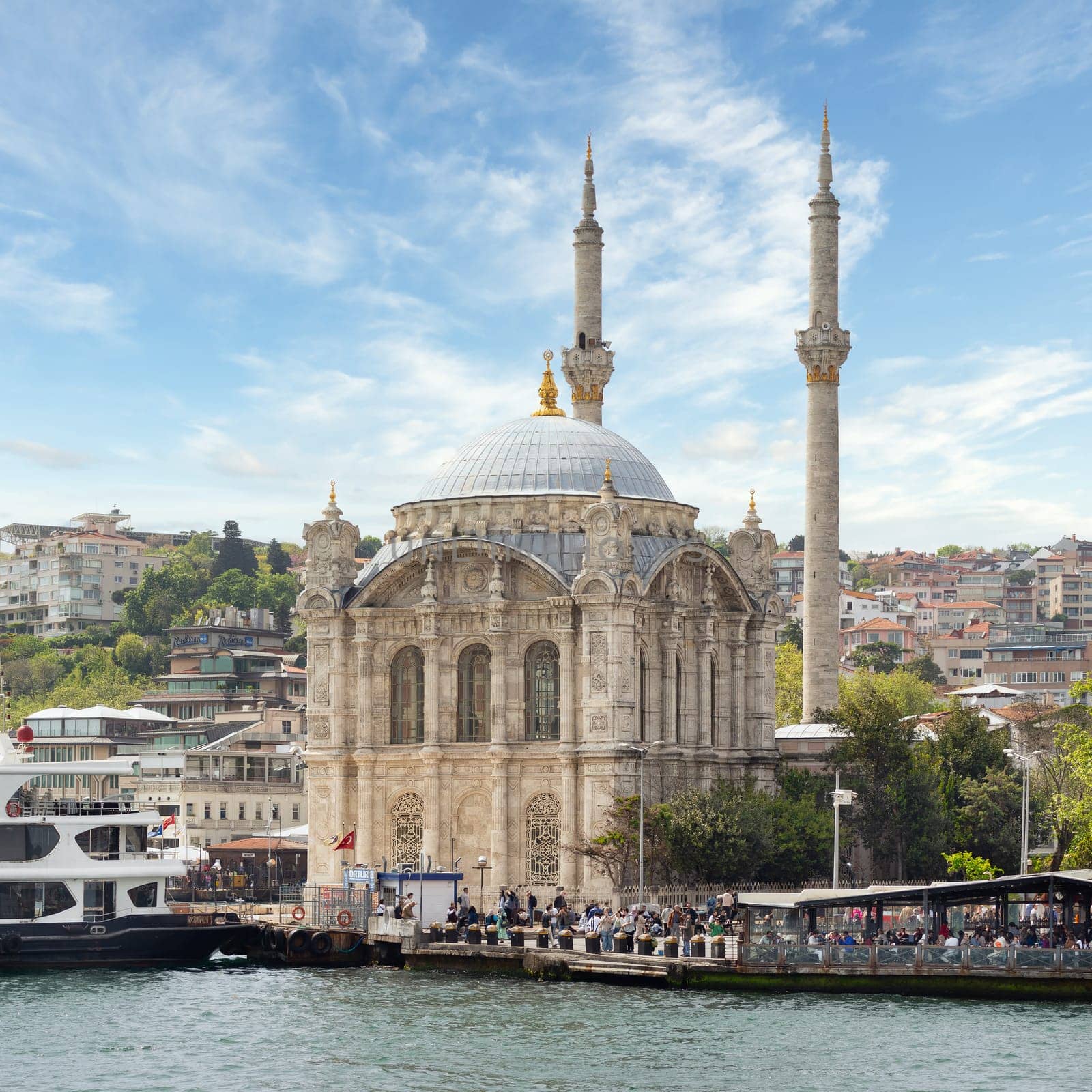 Istanbul, Turkey - May 8, 2023: View from Bosphorus Strait overlooking Ortakoy Mosque, Ortakoy pier square