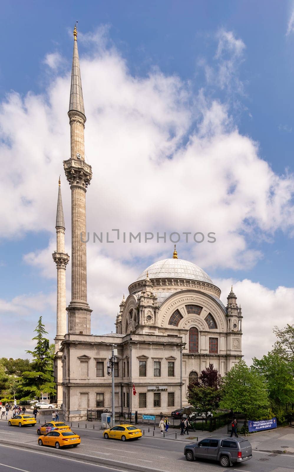 Istanbul, Turkey - May 7, 2023: View from Meclis-i Mebusan Street overlooking Baroque style Dolmabahce Mosque, suited at the waterside of Kabatas, in Beyoglu district