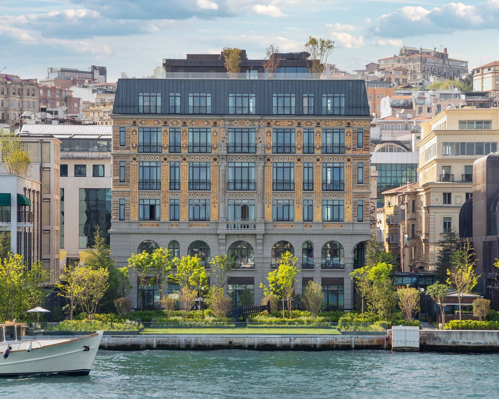 Istanbul, Turkey - May 8 2023: Exterior of Peninsula five stars hotel, suited by Bosphorus Strait, beside Galataport, in a spring day