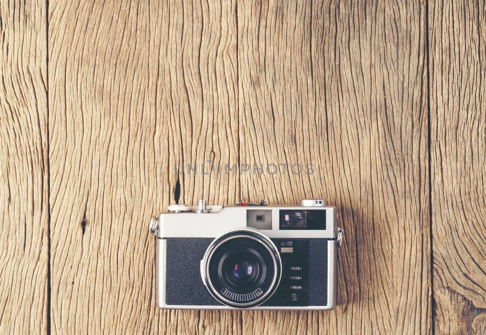 vintage old film camera on wood board with copy space