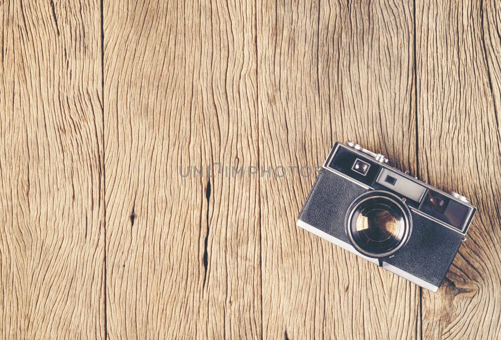 vintage old film camera on wood board with copy space