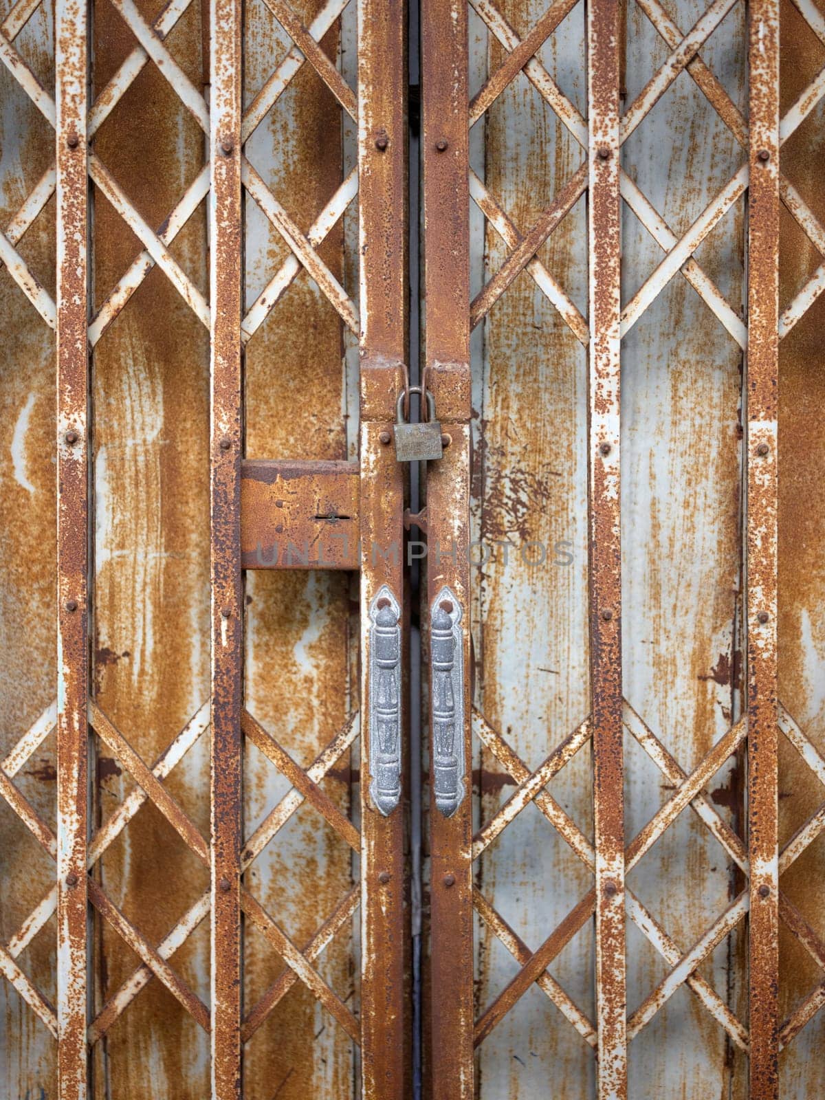 Retro folding steel door for exterior home decoration texture and background in Thai and Asian traditional style . space for text