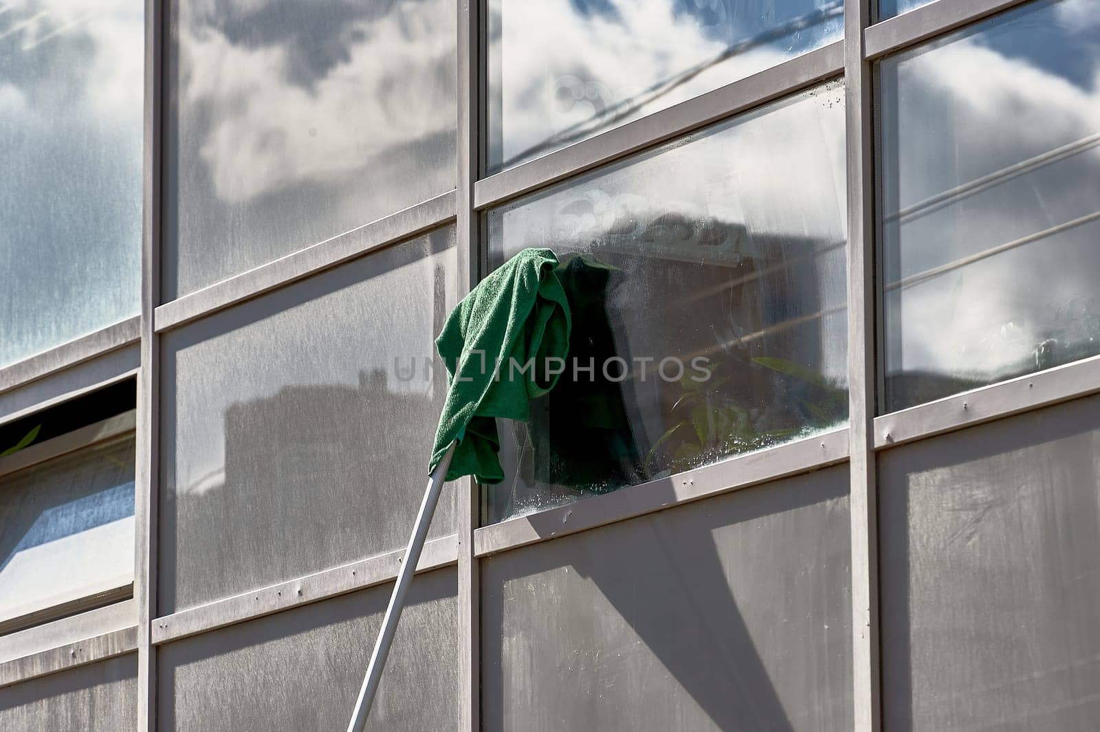 window washing, washing a street shop window. High quality photo