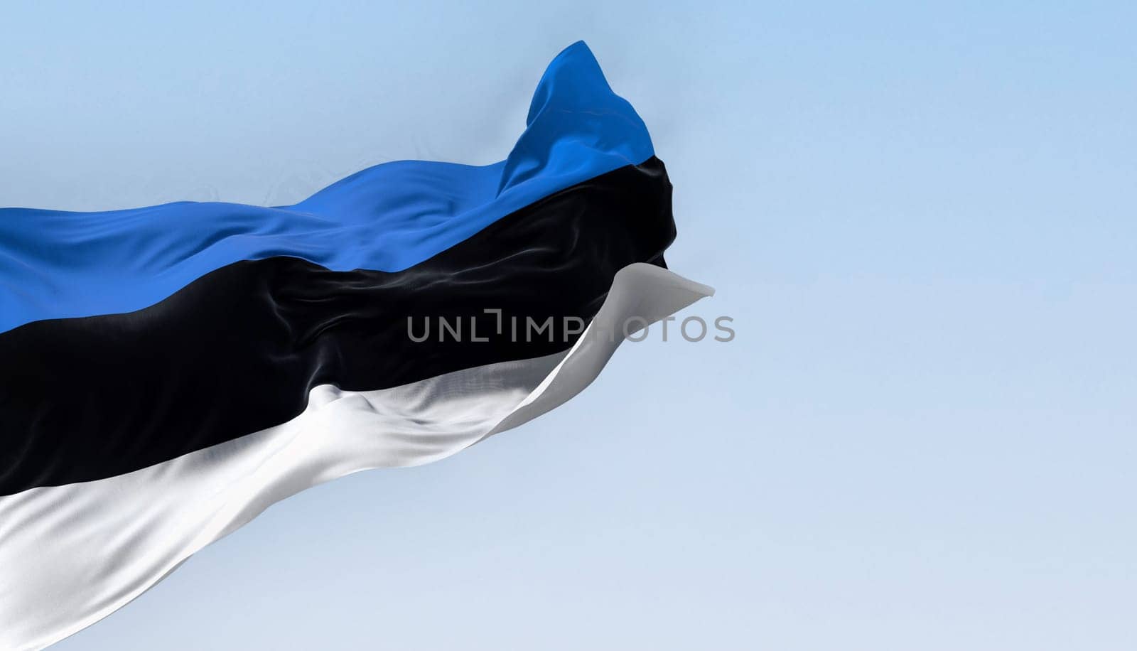 National flag of Estonia waving in the wind n a clear day. horizontal tricolor featuring three equal bands of blue, black and white. 3d illustration render. Fluttering fabric