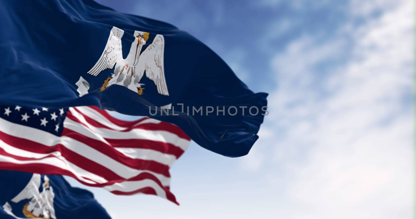 Louisiana state flag waving with the national flag of the United States. 3d illustration render. Fluttering fabric. Selective focus