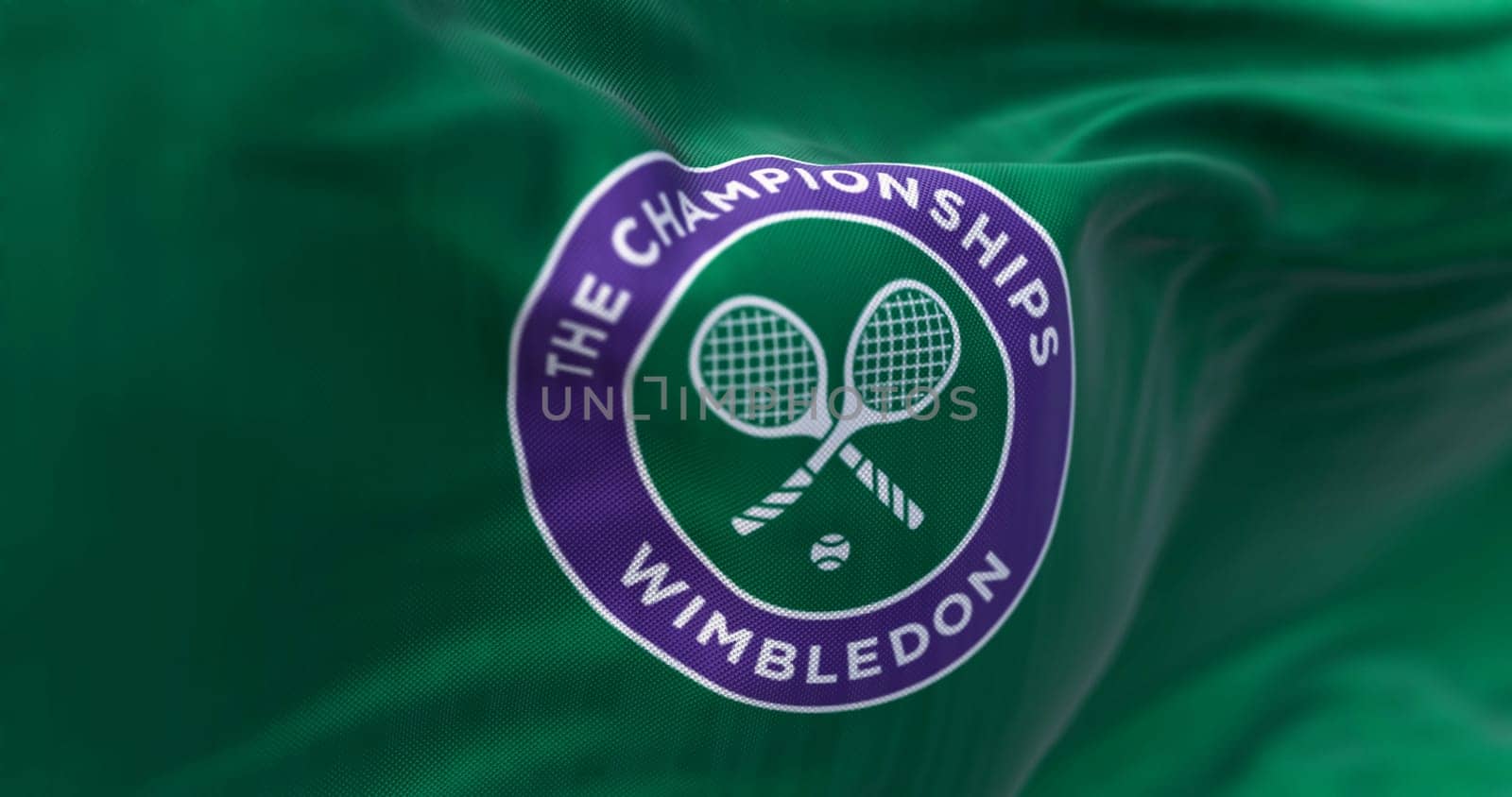London, UK, May 2023: Close-up of the Flag with The Championships Wimbledon logo waving. Wimbledon Championships is a major tennis tournament. Illustrative editorial 3d illustration render.