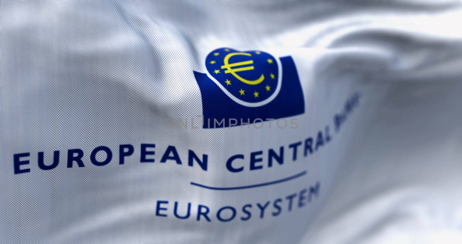 Frankfurt, DE, June 28 2023: Close-up of the European Central Bank flag waving in the wind. Illustrative editorial 3d illustration render. Selective focus