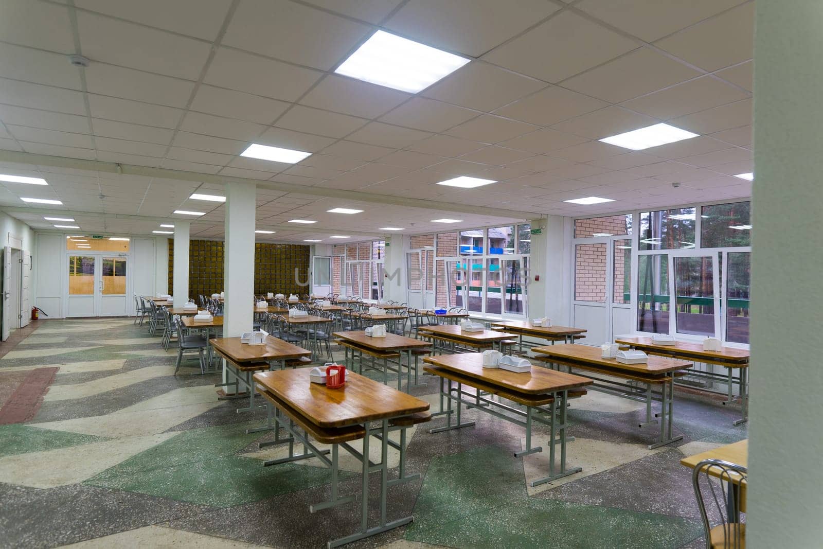 Cafeteria, dining room in a university, cafe with tables and chairs, counter bar hotel.