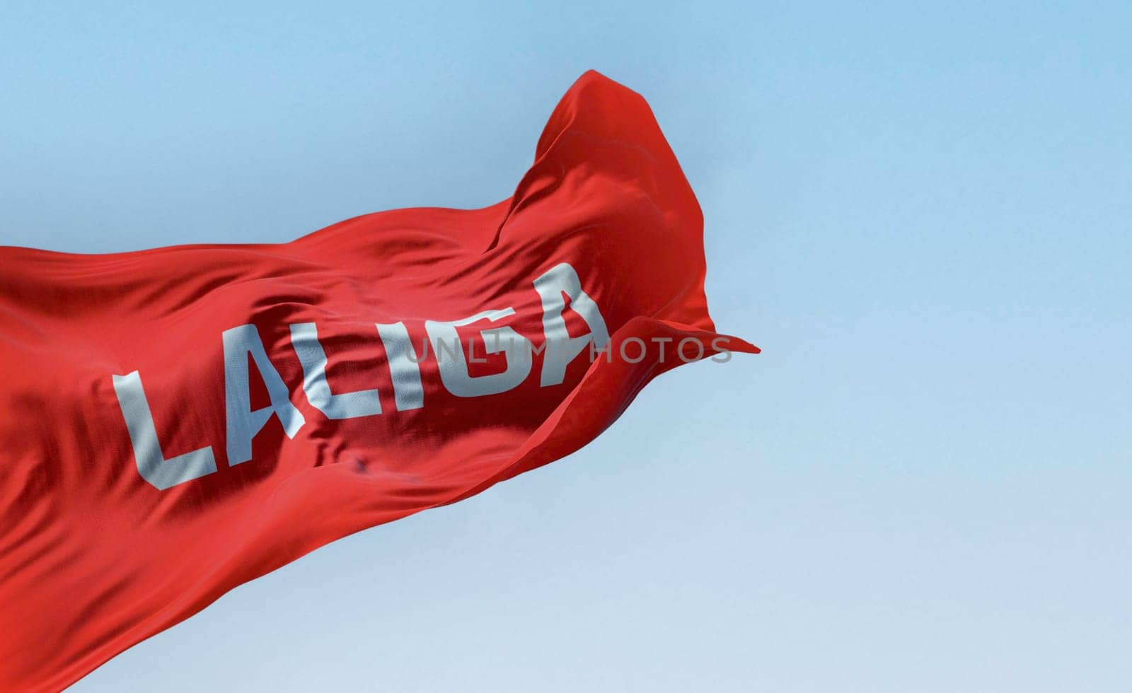 Madrid, SPA, July 10 2023: La Liga flag waving on a clear day. La Liga is the top professional football division of the Spanish football league system. Illustrative editorial 3d illustration render
