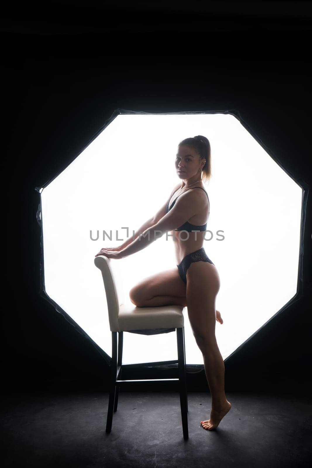 Female silhouette in a lingerie. Young slim seductive woman with sport fitness body
