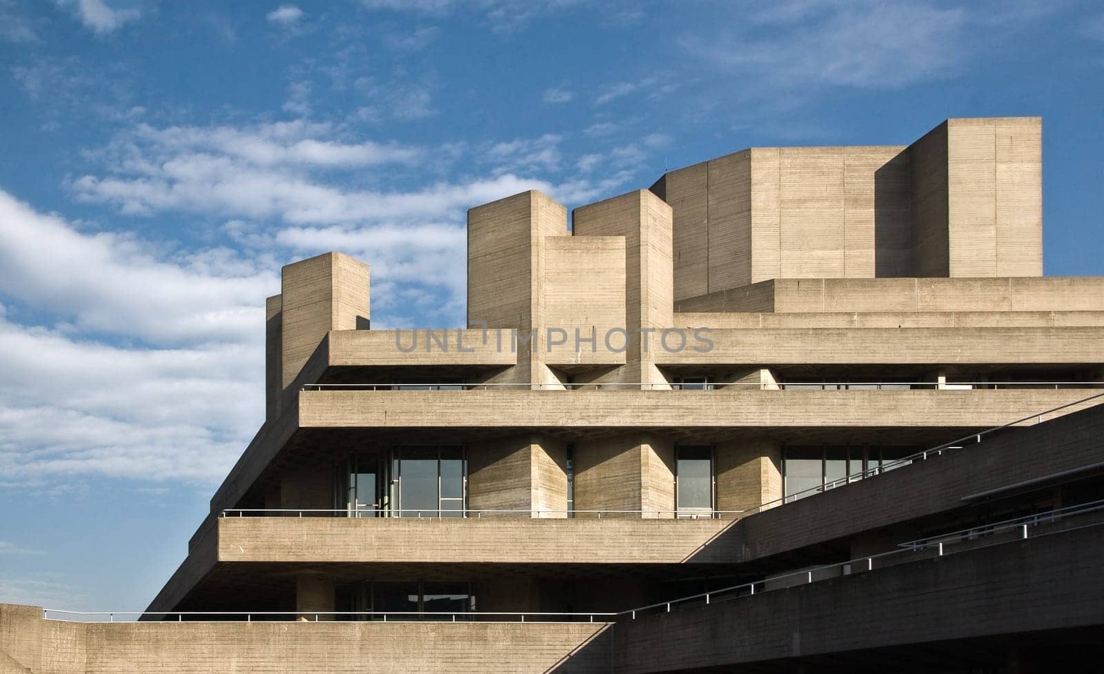 London, United Kingdom - February 17, 2007: Royal National theatre (designed by Sir Denys Lasdun) as seen from Waterloo Bridge. Example of Brutalist architecture movement in UK capital.