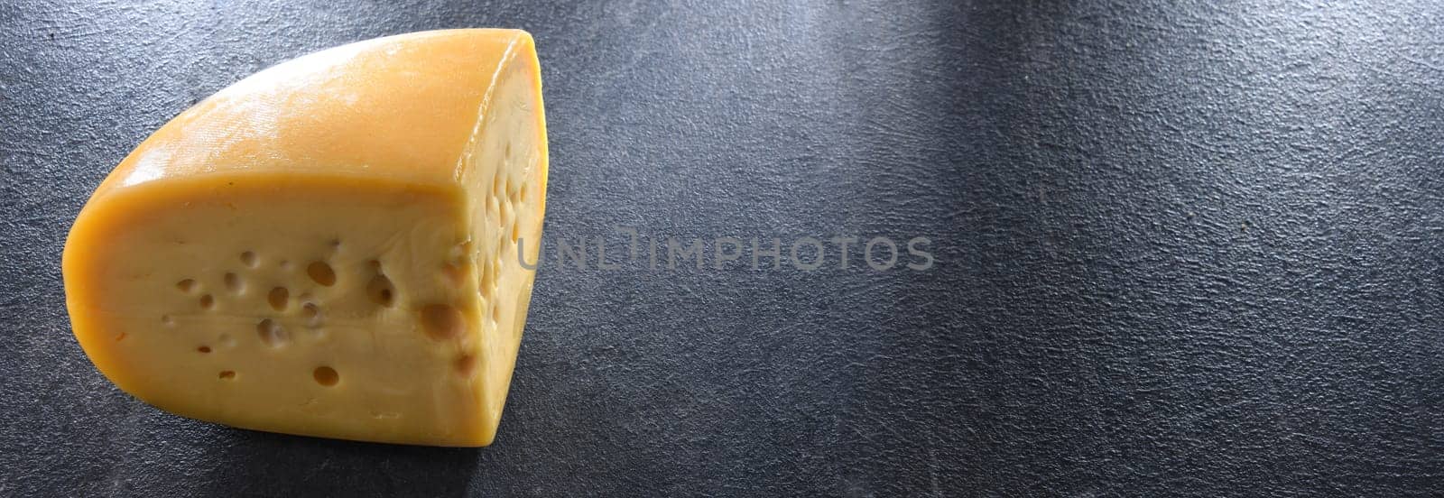 A yellow, medium-hard cheese, classified as a Swiss-type or Alpine cheese