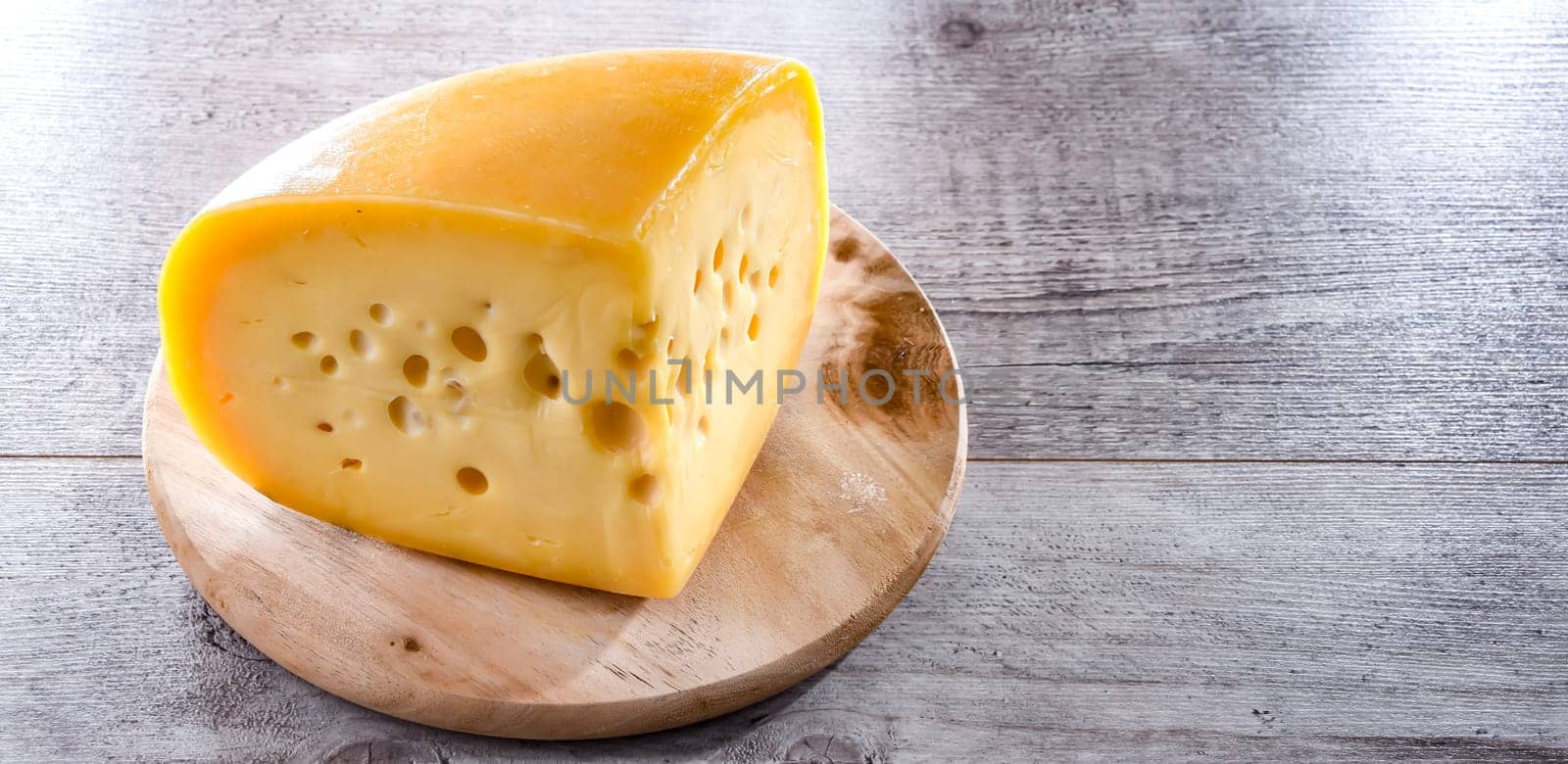 A yellow, medium-hard cheese, classified as a Swiss-type or Alpine cheese