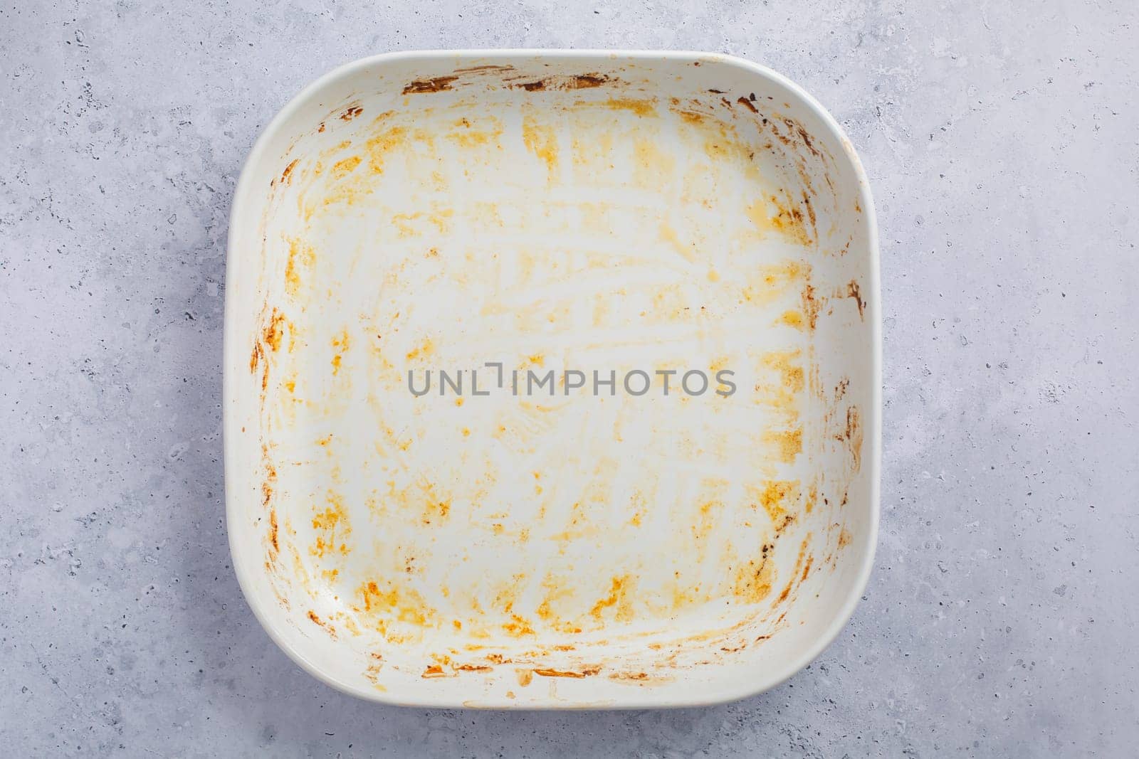 Baking tray or casserole with burnt on grease
