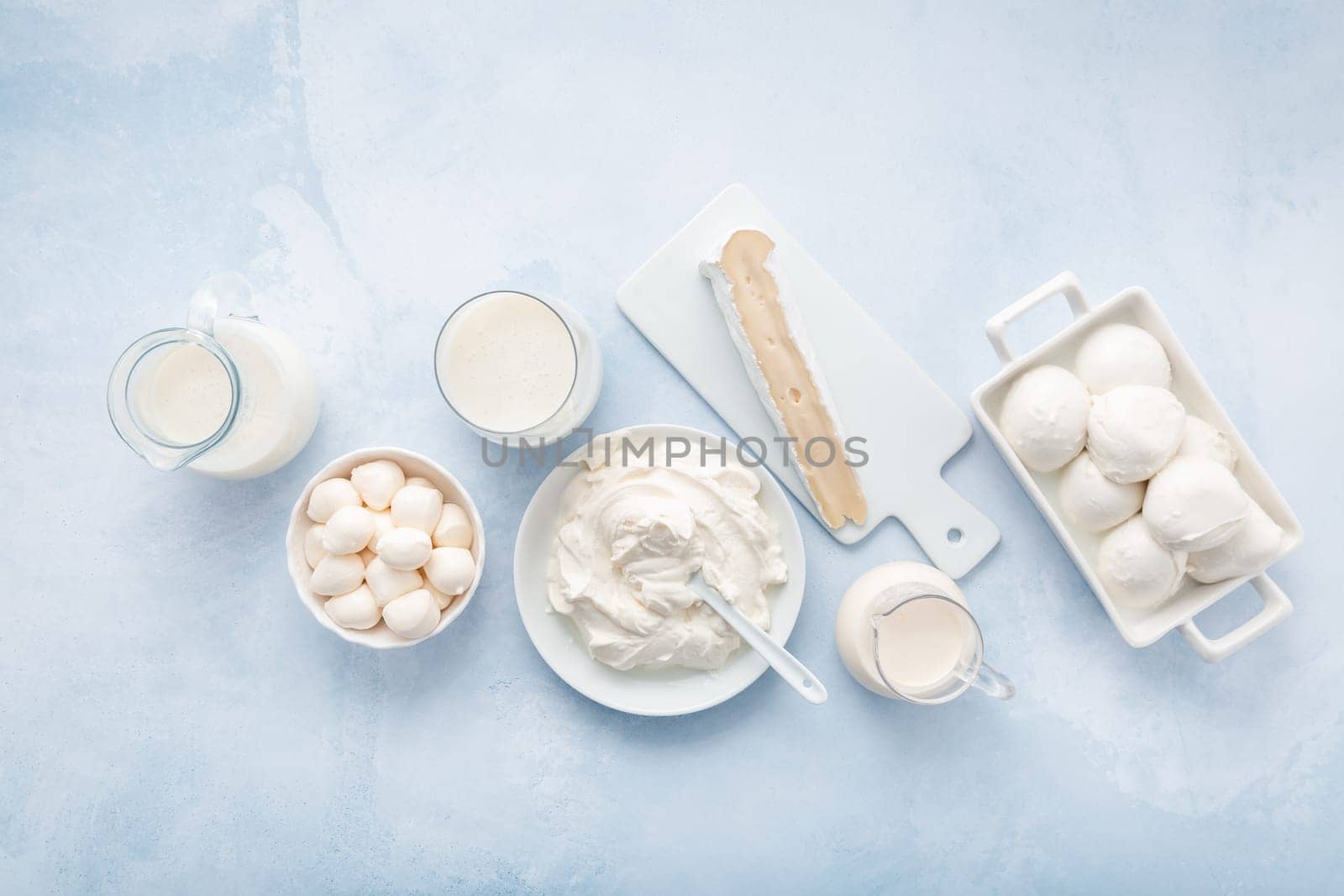 Assortment of milk products - buttermilk, kefir, yogurt with probiotics, ayran, cheese, mozzarella, quark and cream.