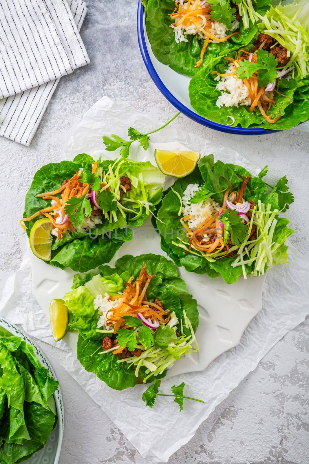 Asian minced meat lettuce wraps with rice, bean sprouts and cabbage