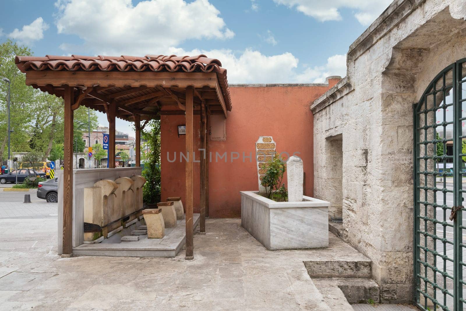 Istanbul, Turkey - May 5, 2023: Tomb of Selman Efendi, and ablution fountain attached to Selman Aga Mosque, or Selman Aga Camii, ottoman era historical mosque in Mimar Sinan neighborhood, Uskudar