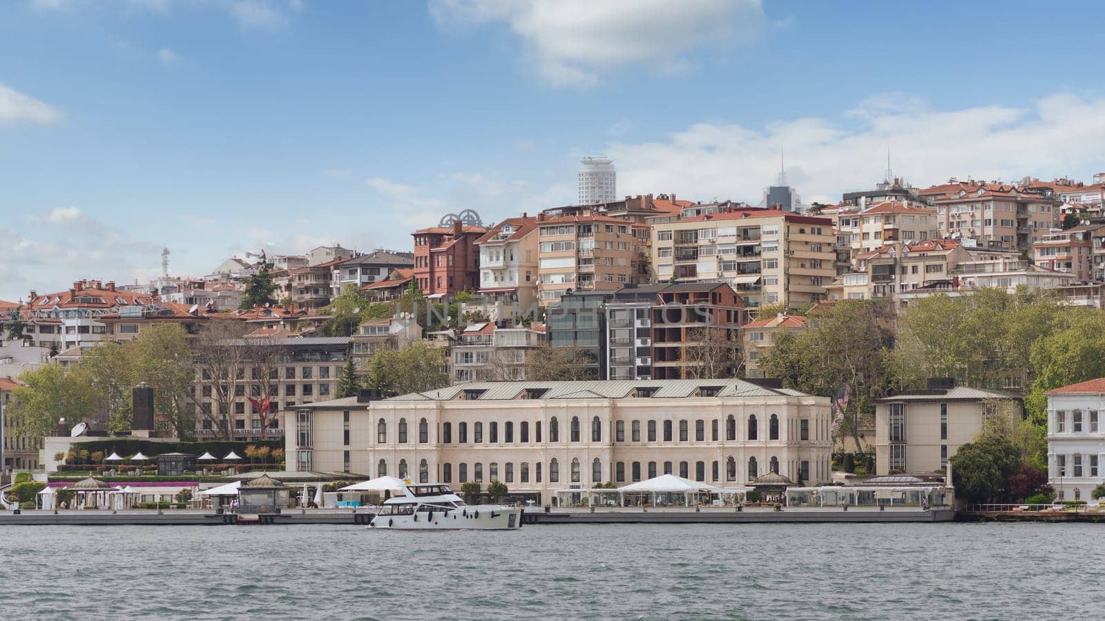 Istanbul, Turkey - May 8, 2023: Exterior of modern architectural design five stars Four Seasons hotel, suited by Bosphorus Strait, at Besiktas district, in a spring day