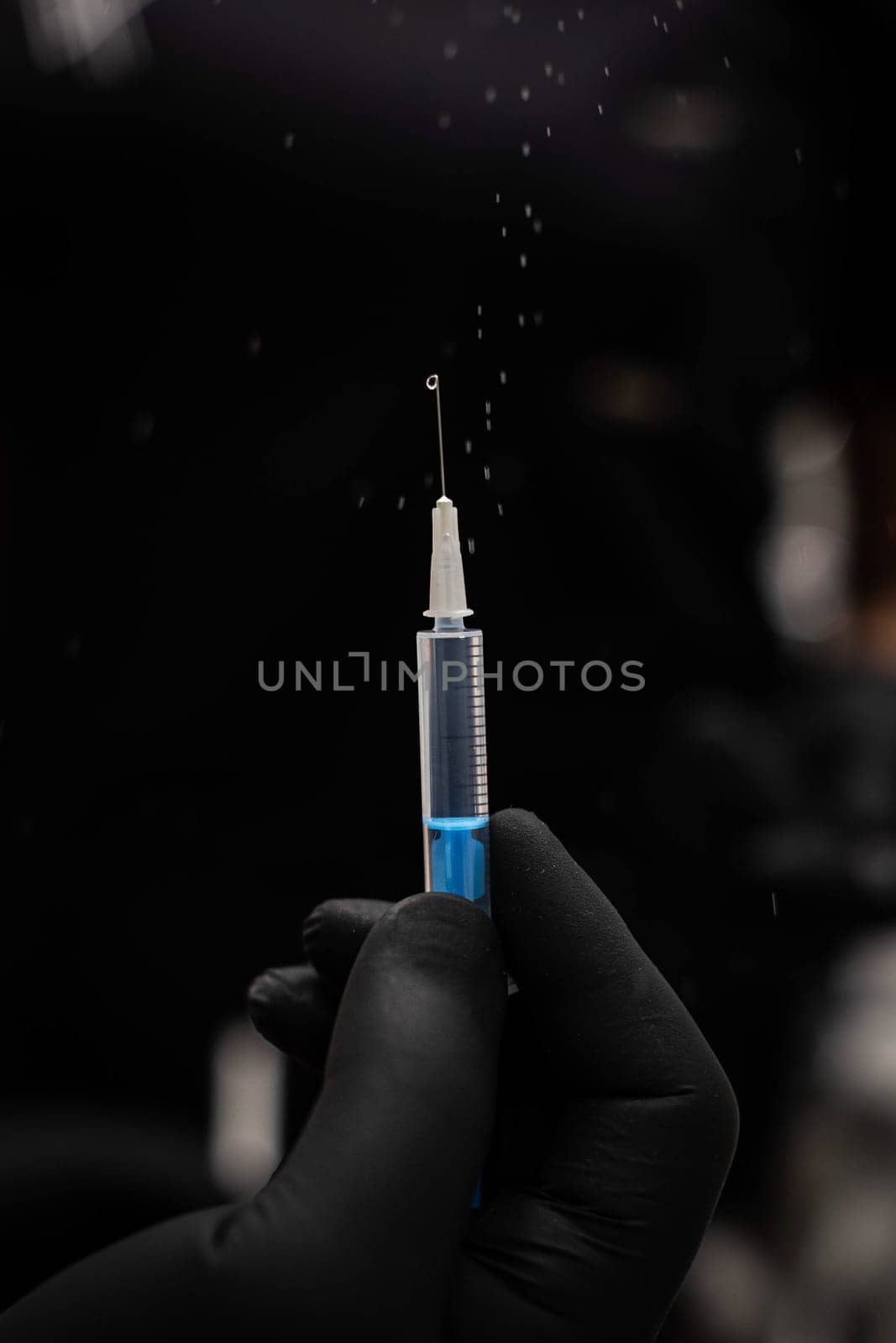 doctor holding a syringe with a needle. doctor holding a syringe. syringe with needle
