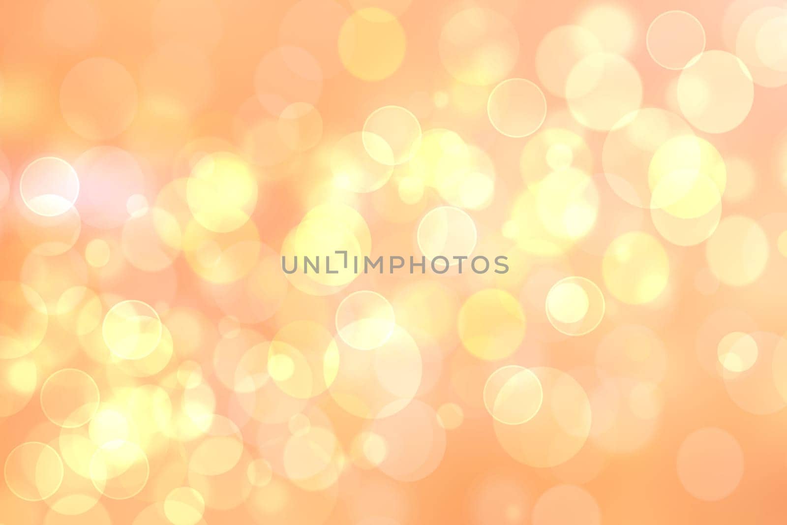 A festive abstract delicate golden yellow orange gradient background texture with glitter defocused sparkle bokeh circles. Card concept for Happy New Year, party invitation, valentine or other holidays.