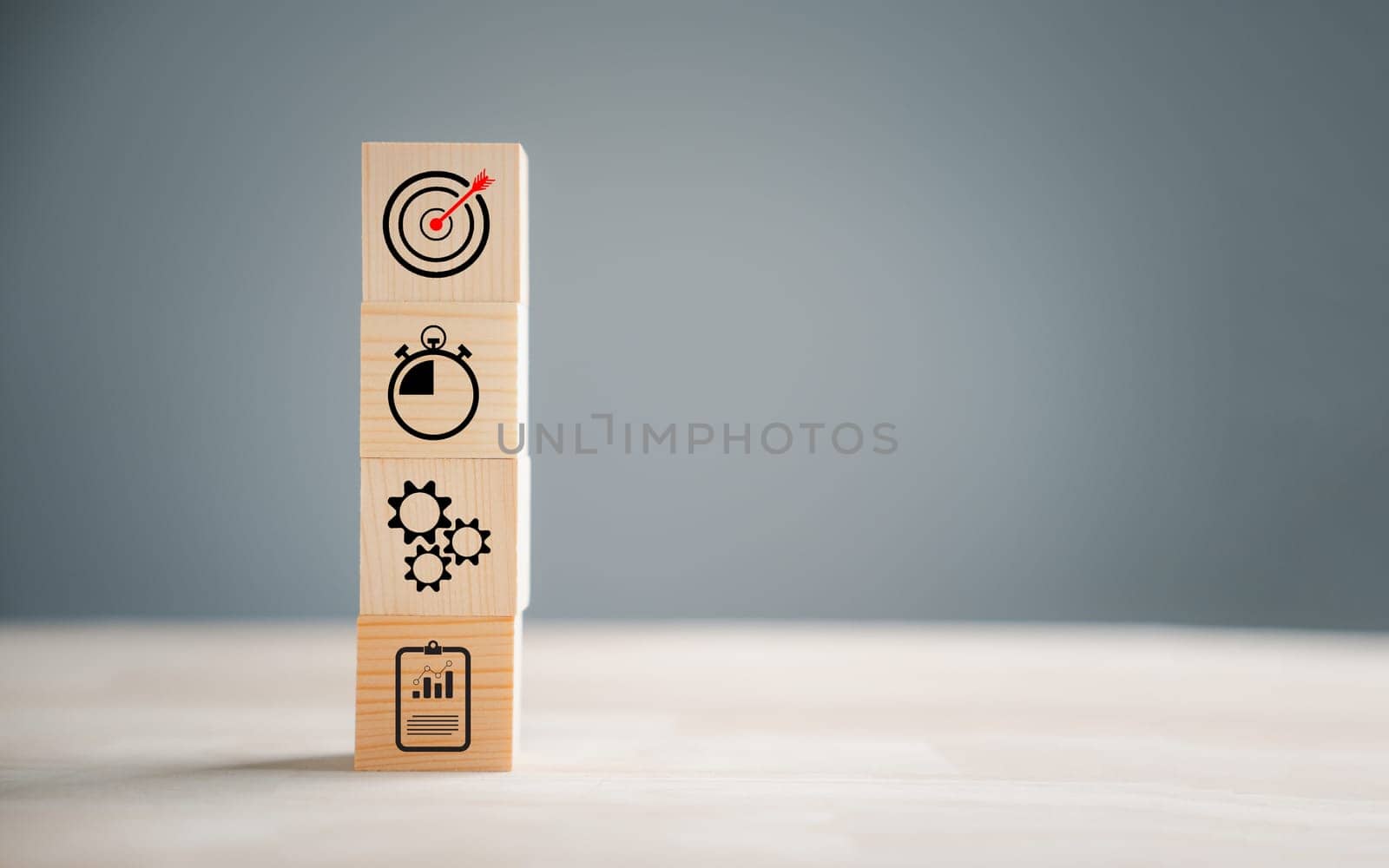 Action Plan, Goal, and Target icons on a wooden block step. Success and business target concept. Company strategy and project management symbolize progress.