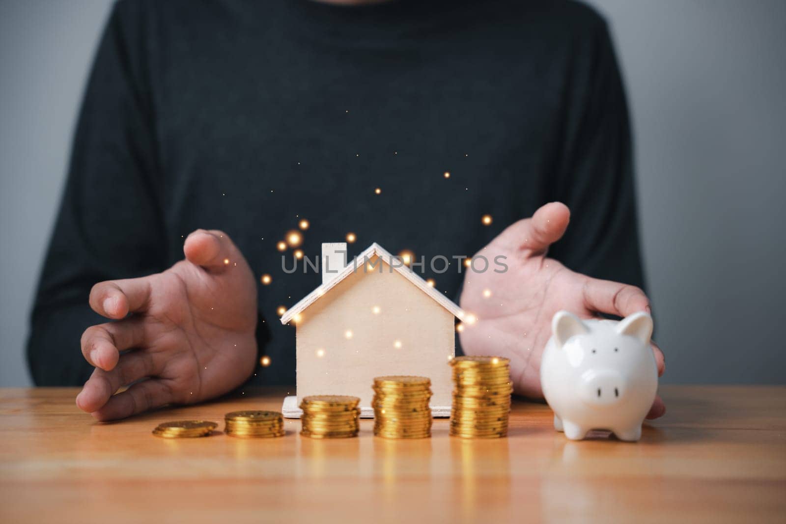 A man inserting coins into a piggy bank, representing the concept of saving money for a rainy day. Personal finance and budgeting is key to achieving financial success.
